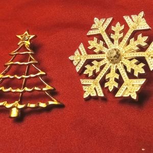 Two Christmas pins. One tree and one snowflake pins.